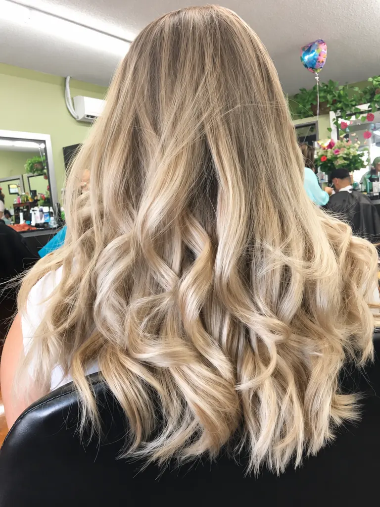 Long ash-blonde waves with lived-in dimension, back view